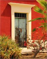 Old Green Door And Red Adobe